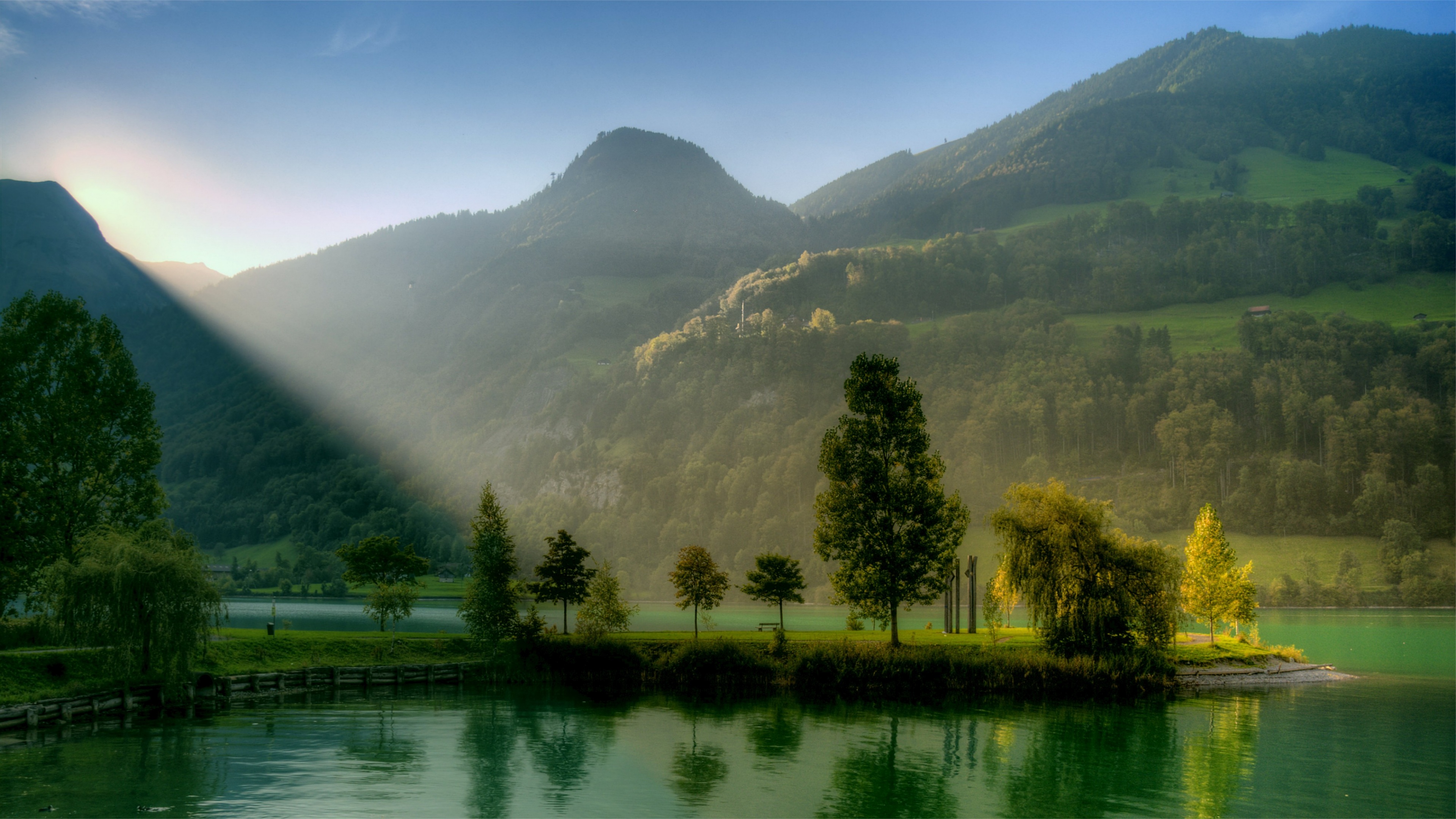 Sunlight Over Mountain Lake Wallpaper