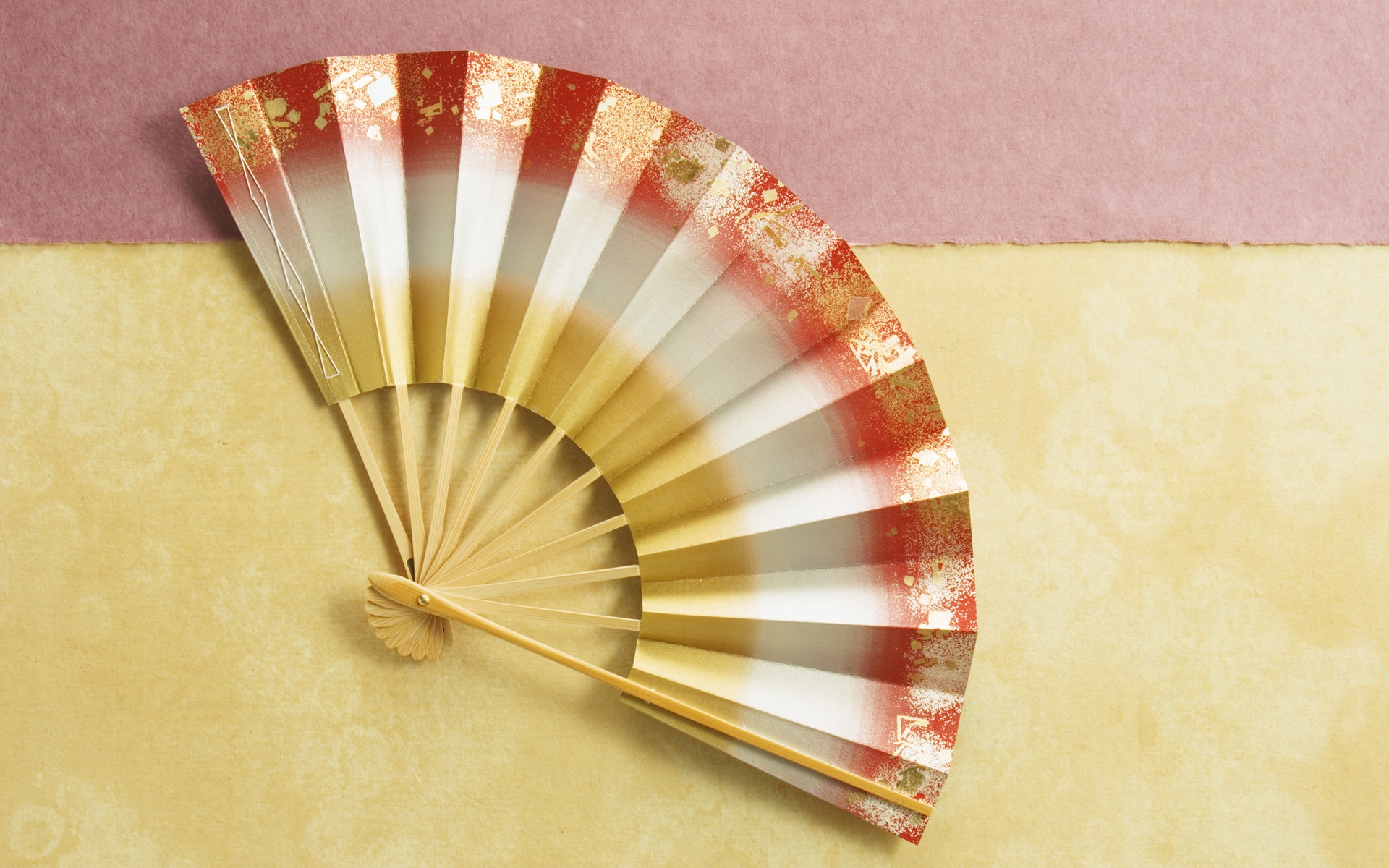 hand fan yellow orange Wallpaper