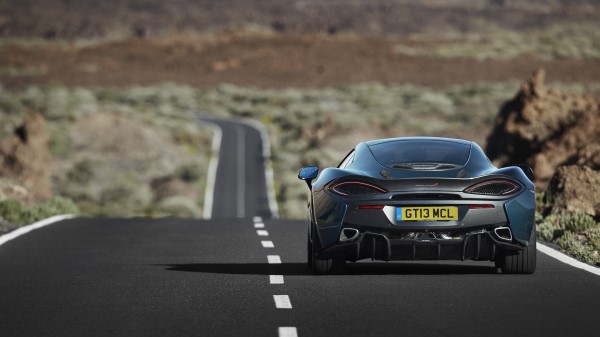 Mclaren 570gt Road Rear View Wallpaper