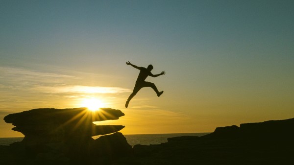 Man Jump Rocks wallpaper