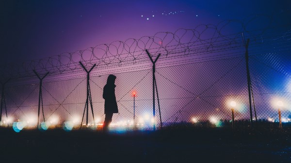 Man Silhouette Night Barbed Wire wallpaper