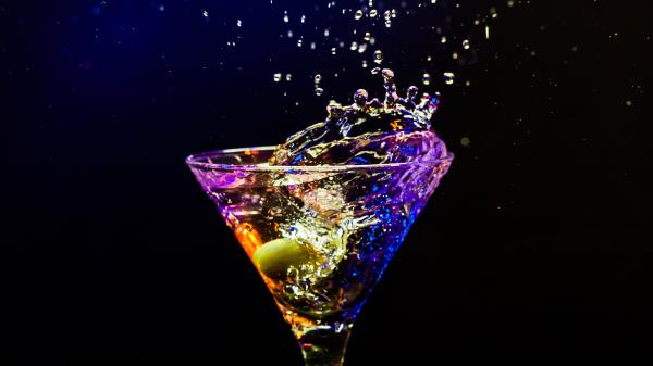 Cocktail Olive Glass Spray Black Background wallpaper