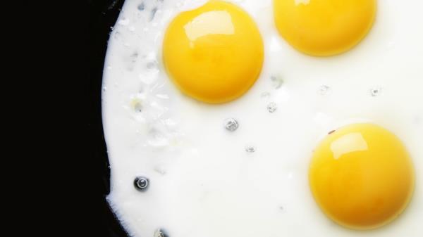 Egg Yolks Three Fried Eggs Black Background wallpaper