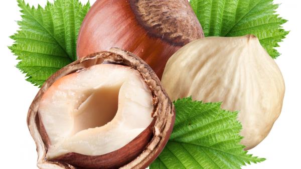 Nuts Cut Shells Leaves White Background Three wallpaper