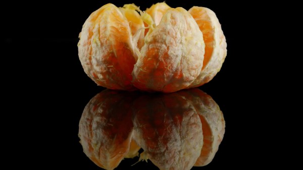 Tangerine Slices Black Background Reflection wallpaper