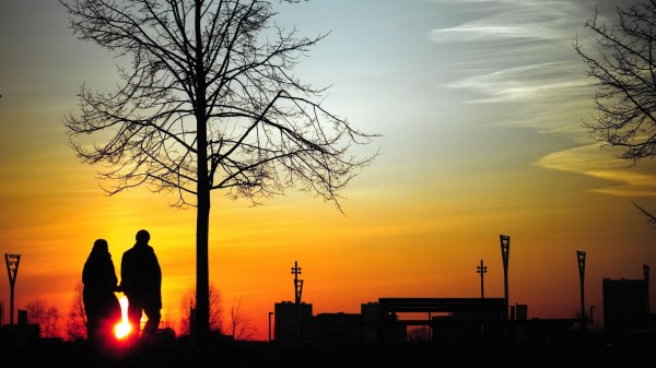 Couple Silhouettes Sunset wallpaper