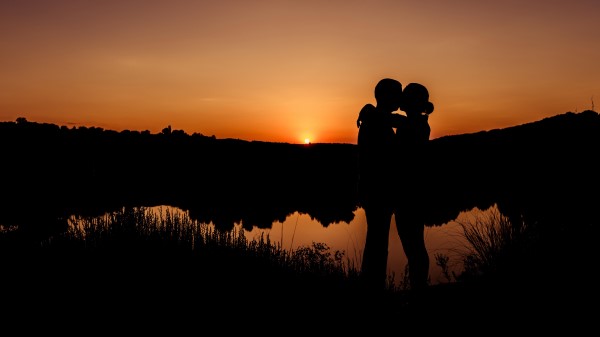 Romantic Kiss Couple Sunset 8k wallpaper