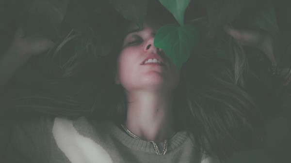 Women Lying Down Green Leaves Closed Eyes Diffused 8k wallpaper