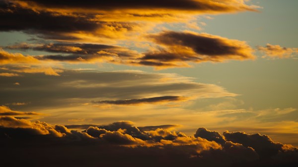 Clouds Backlit Dark Wallpaper