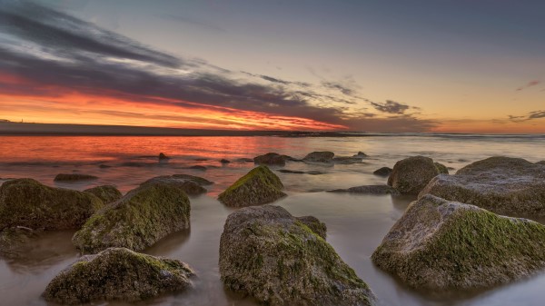 Horizon Sunset Stones Wallpaper