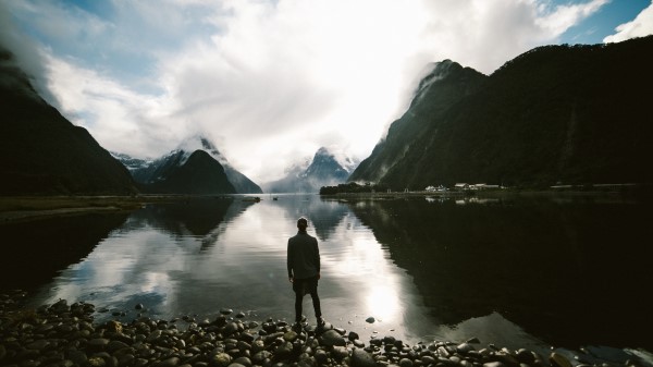 Lake Mountains Rocks Man Loneliness Wallpaper