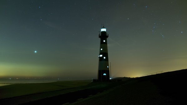 Lighthouse Glow Night Wallpaper
