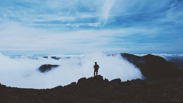 Man Silhouette Mountains Clouds Top Wallpaper