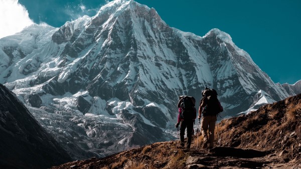 Mountain Peak Tourists Wallpaper