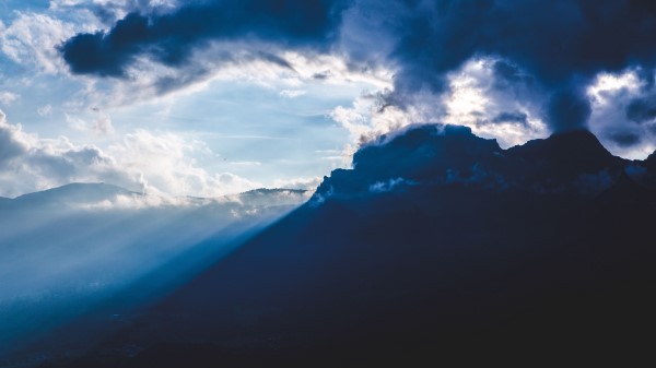 Mountains Clouds Rays Wallpaper