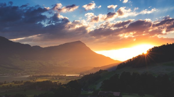 Mountains Light Sun Sky Clouds Wallpaper