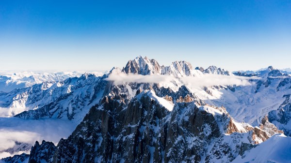 Mountains Tops Snow Sky Wallpaper