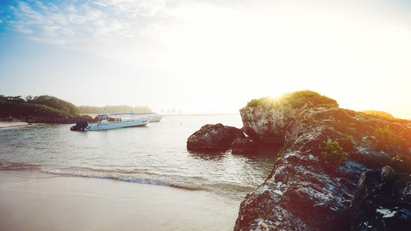 Ocean Boats Rocks Shore Sunlight Wallpaper