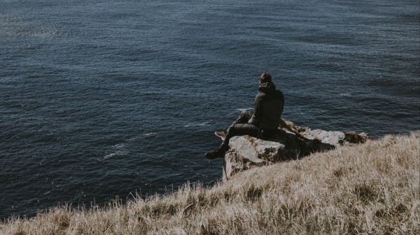 People Rocks Sea Wallpaper