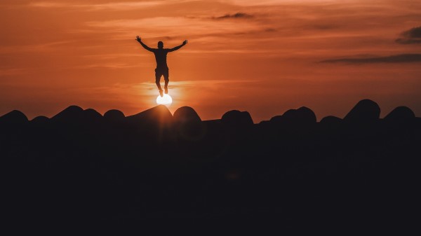 Silhouette Mountains Jump Sunset Wallpaper