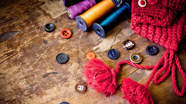 Symbolism Sewing Thread Buttons Wooden Background wallpaper